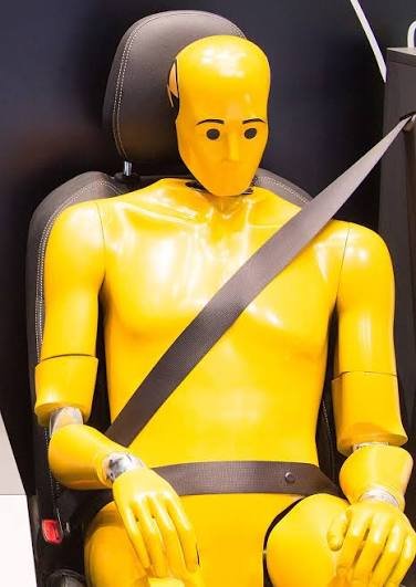 A driver fastening the seat belt before setting off